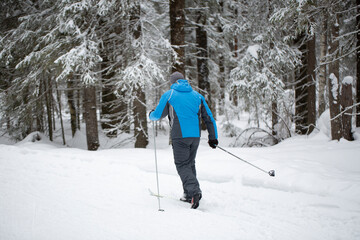 Cross-country skiing.A skier goes skiing in winter on a ski run.