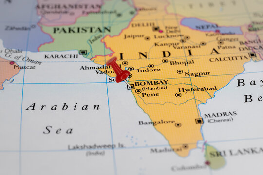 Colorful tourist location map with red stick pin at  Bombay, India, and the surrounding countries