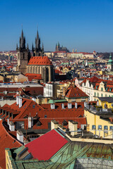 Fototapeta premium Gothic Church of Our Lady before Tyn with St. Vitus Cathedral and Prague Castle in background, Prague, Czech Republic, sunny day