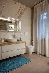 Luxury bathroom with marble wall and modern design