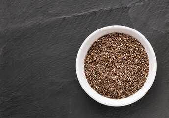 Organic fresh chia seeds in the bowl - Salvia hispanica.