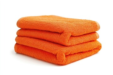 Orange towels stacked against white background