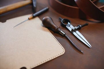 Tools for leather craft on leather backgroung