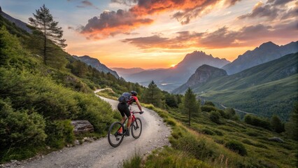 Fototapeta premium a cyclist enjoys a scenic mountain bike ride at sunset. The cyclist is silhouetted against the vibrant sky, with the rugged mountain landscape in the background
