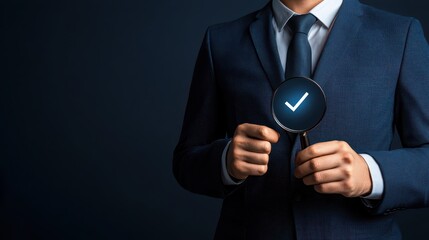Businessman Holding Magnifying Glass with Checkmark Symbol for Hiring and Recruitment Concept
