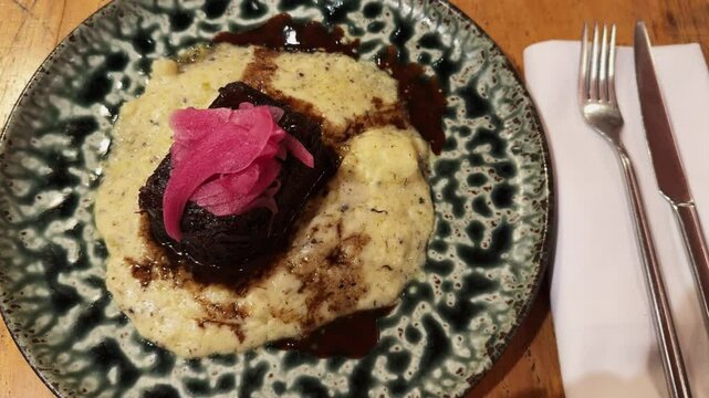 Galician beef cheek ingot with potato parmentier at the restaurant in Barcelona. High quality 4k footage