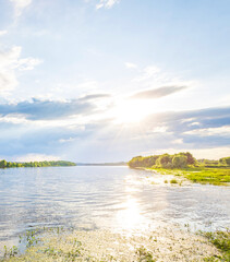 Calm lake with a cloudy sky in the background