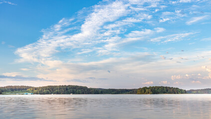A beautiful lake with a clear blue sky above it