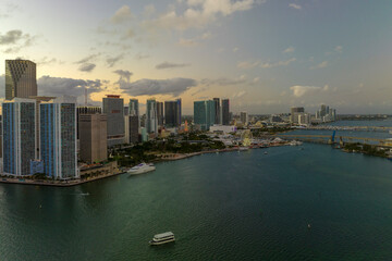 Naklejka premium Aerial view of downtown district of of Miami Brickell in Florida, USA at sunset. High commercial and residential skyscraper buildings in modern american megapolis