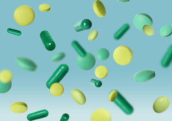 Many different pills flying on light blue background
