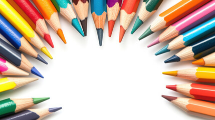 Fototapeta premium Vibrant colored pencils arranged in a circle with white space center