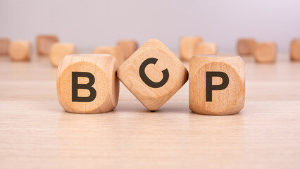 Wooden blocks with "BCP" letters, symbolizing business continuity, risk management, and strategy