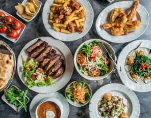 Top View of a Large Assortment of Delicious Foods Featuring Tofu Salad, Beef Steak, Pizza, Crab Soup, Fish and Chips, and Grilled Chicken