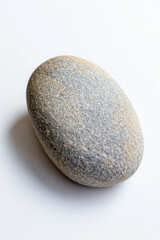 Smooth oval stone with a textured gray surface on a white background, showcasing natural beauty and simplicity.