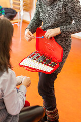 red portable xylophone for music lesson