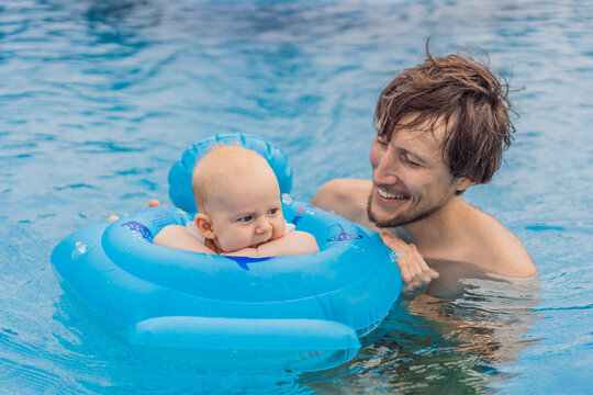 A father enjoys swimming in a pool with his son infant, who is safely placed in an inflatable baby float. Fun family bonding, summer relaxation, and parenting concept
