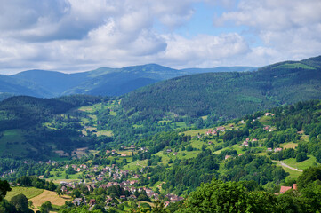 Obraz premium Rolling hills and lush valleys in the Vosges mountains during summer