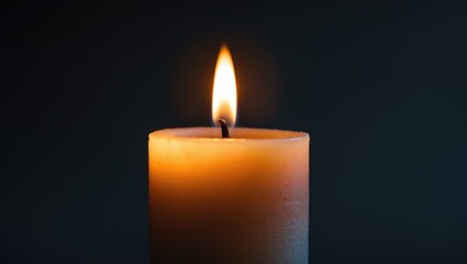 Flame of a candle burning in darkness, candles illuminating the dark.