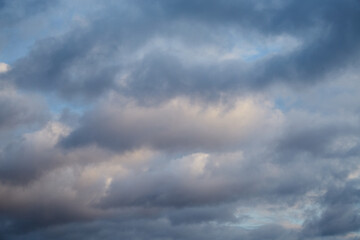 Strips of clouds create a sense of movement against the blue sky, as if the wind is pushing them forward. Symbolizes speed and change.