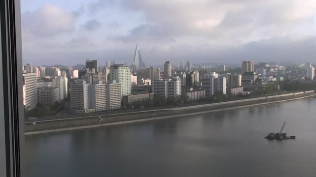 View across Taedong river towards city centre, Pyongyang, North Korea