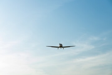 Single engine ultralight aircraft flying in the sky. empty space for insertion.