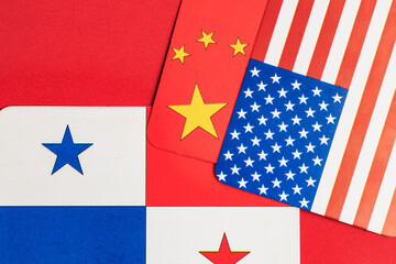 Flags of panama, china, and the united states on a red background