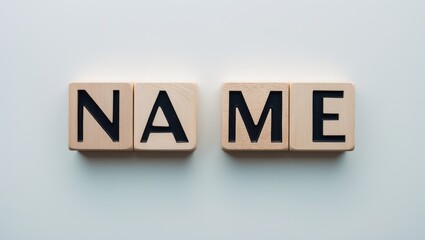 Wooden letters forming the word NAME.