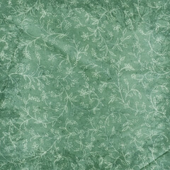 Green textured floral fabric with subtle line-art leaves and vines. Seamless organic pattern great for quilting, textiles, nature themes, and rustic backgrounds.