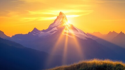 Fototapeta premium Majestic Mountain Peak at Sunrise with Golden Rays of Sunlight