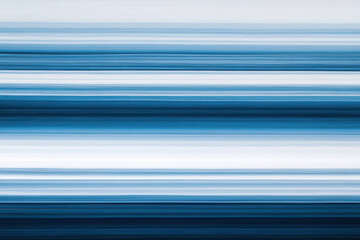 Fototapeta premium Abstract horizontal blue and white stripes with blurred motion effect for tech and modern designs
