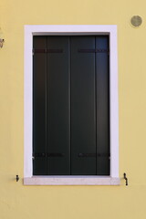 Typical renaissance window in Burano, Italy