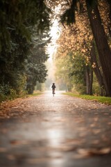 Child biking on autumn path. Golden leaves, soft light.