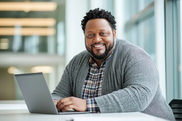 Happy Black Man Working on Laptop in Modern Office