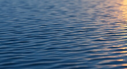 Serene Sunset Water Surface: A Captivating View of Rippling Water at Golden Hour
