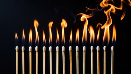 Fototapeta premium The stages of match combustion on a dark backdrop. Safe match. Various stages of matchstick combustion. From ignition to extinguishment. Blank space, banner.