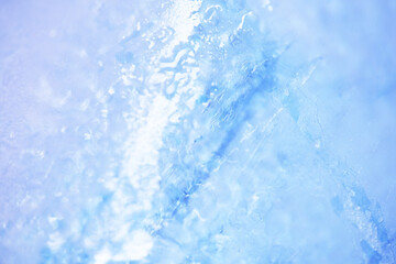 Close up texture of frozen lake cracked ice as background