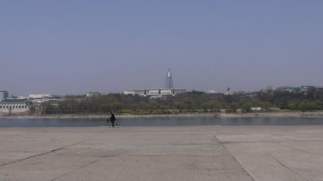 North korean riding on the banks of Taedong river, Pyongyang, North Korea
