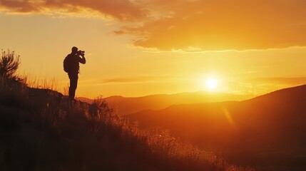 A photographer captures a beautiful sunset over mountain landscape