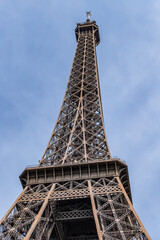 Eiffel Tower against the blue sky. Eiffel Tower is most visited monument in the world. Paris, France.