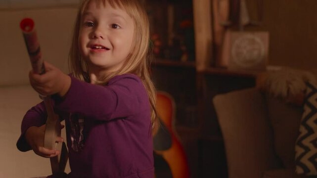 Little Girl Playing with a Pop Gun