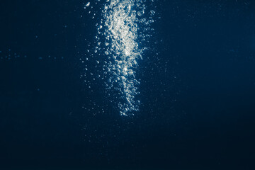 underwater splash bubbles in blue water environment