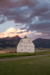 Rustic Barn in Bozeman, Montana with Vibrant Sunset and Mountain Backdrop