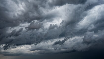 Moody overcast sky background, fleecy clouds texture, ominous skies in cold windy weather-