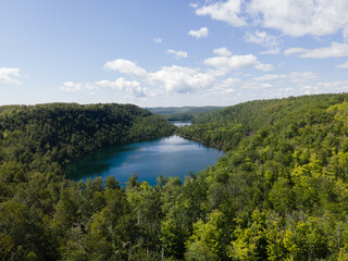 Aerial view of Bean and Bear Lakes in Silver Bay, Minnesota, surrounded by lush forests.