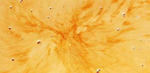 Drop of black coffee or tea onto milk