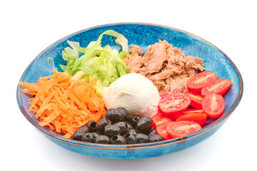 Salad with Buffalo mozzarella, tuna fish, cherry tomatoes, iceberg salad, olives, carrots,  in the blue plate with white background