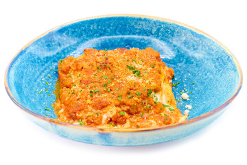 Traditional italian dish lasagna alla bolognese in the blue plate with white background