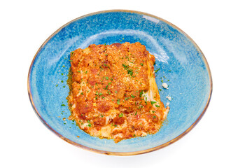 Traditional italian dish lasagna alla bolognese in the blue plate with white background