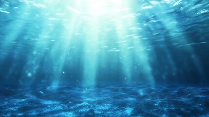 Fototapeta premium Underwater scene with light beams illuminating the ocean depths.