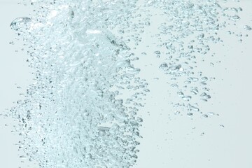 Many water bubbles on light background, closeup